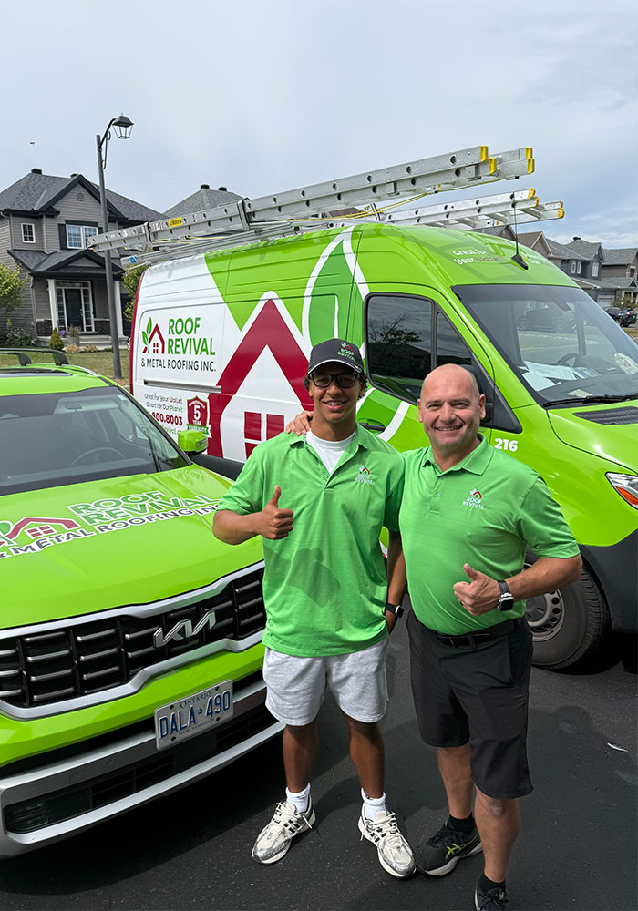 roofing company team standing beside branded service vehicles in Ottawa neighborhood