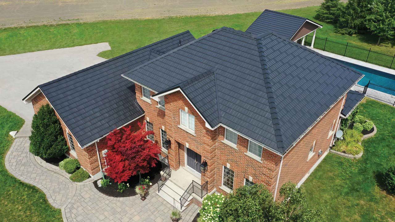 Large residential home with stone-coated metal roofing system